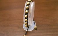 Bratara handmade cu pietricele tip swarovski aurie