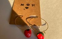 Strawberry earrings on golden hoops