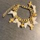 Bratara Aurie Handmade cu Fundite Albe si Charmuri